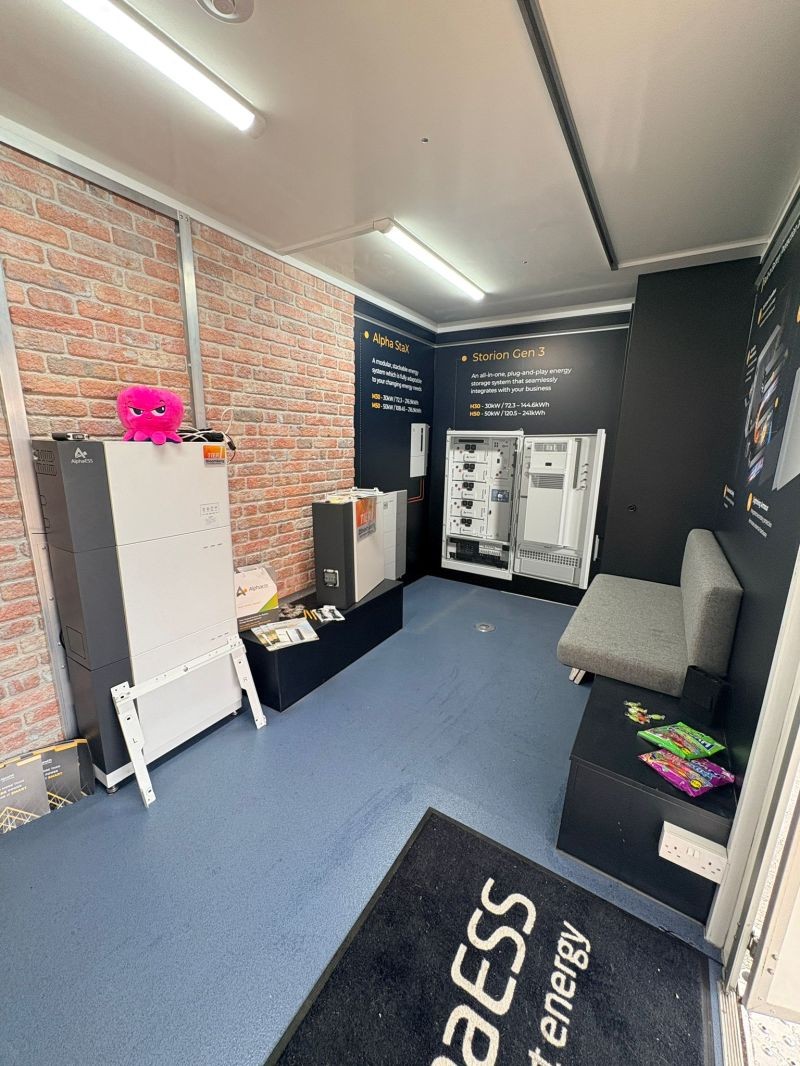 Inside BESSIE, the AlphaESS UK mobile showroom, with battery systems on display