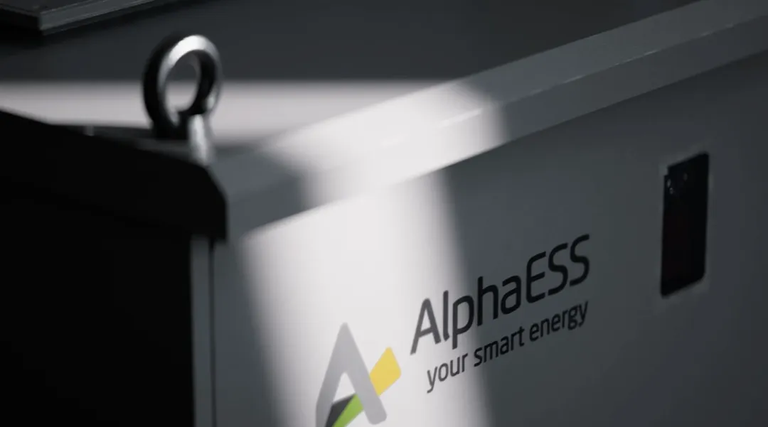 Close-up of an AlphaESS commercial battery storage cabinet showing the AlphaESS logo
