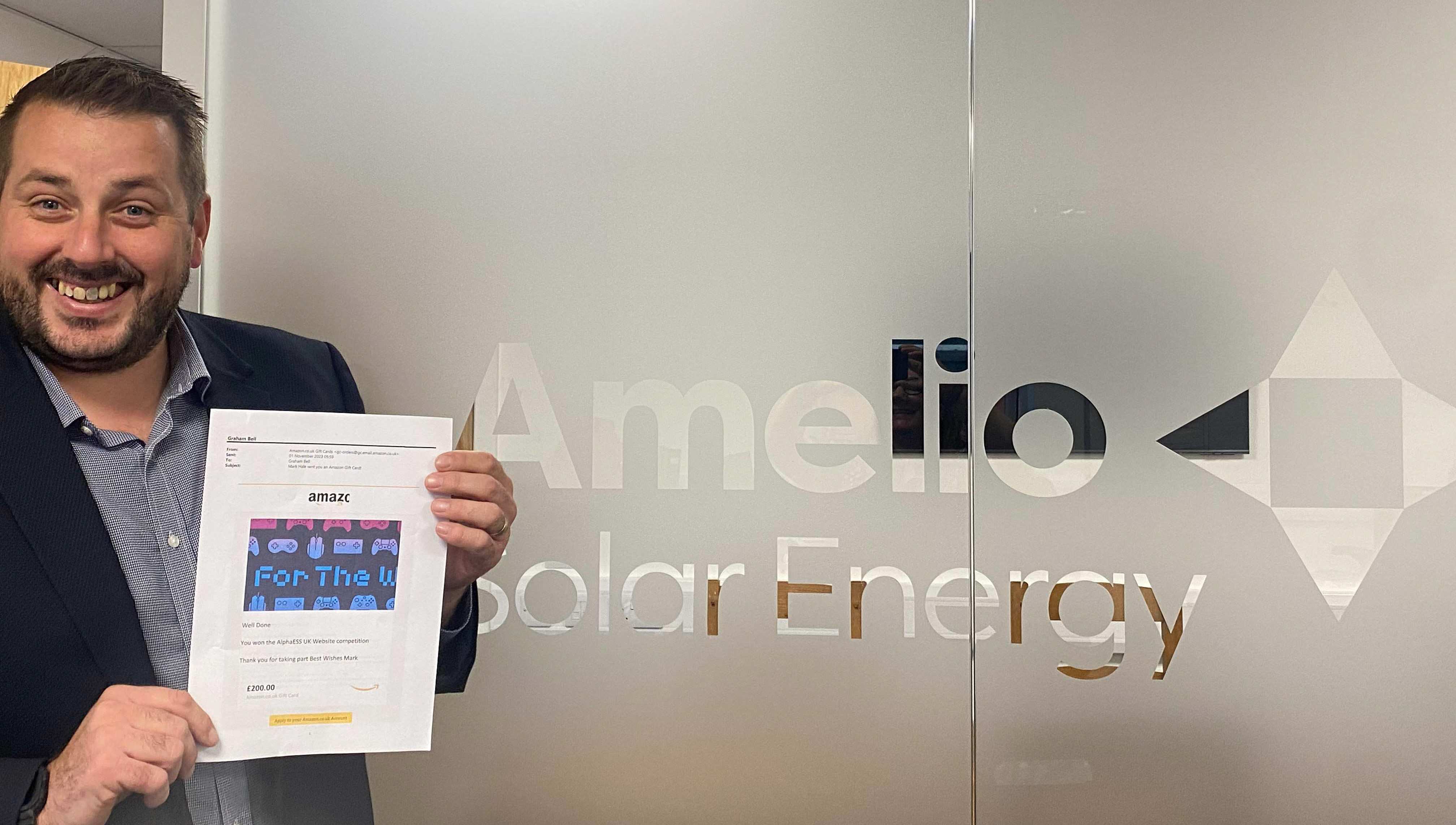 Graham Bell of Amelio Pictured with his winning £200 amazon voucher courtesy of AlphaESS UK